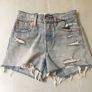 High waisted, distressed wedgie fit shorts